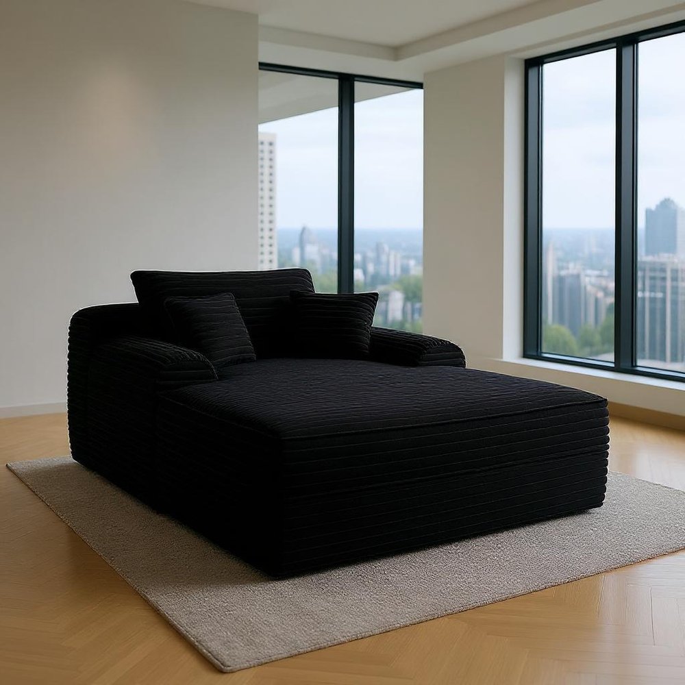 67" Black Corduroy Oversized Chaise Lounge Chair And Toss Pillows shown outdoors on an outdoor setting.
