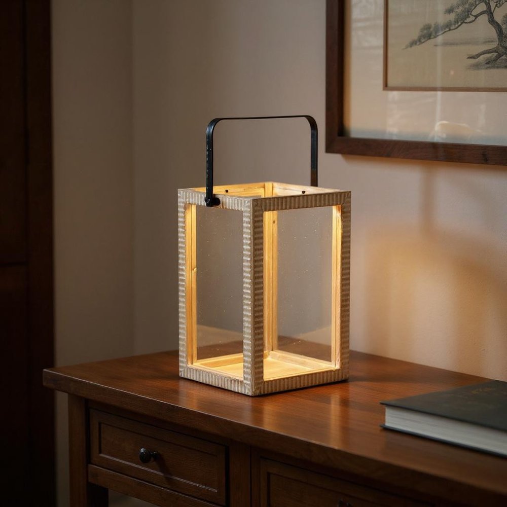 16" Clear And Natural Glass And Solid Wood Tabletop Lantern Candle Holder displayed on a tabletop in a furnished interior against a dark brown wall in tan wood.