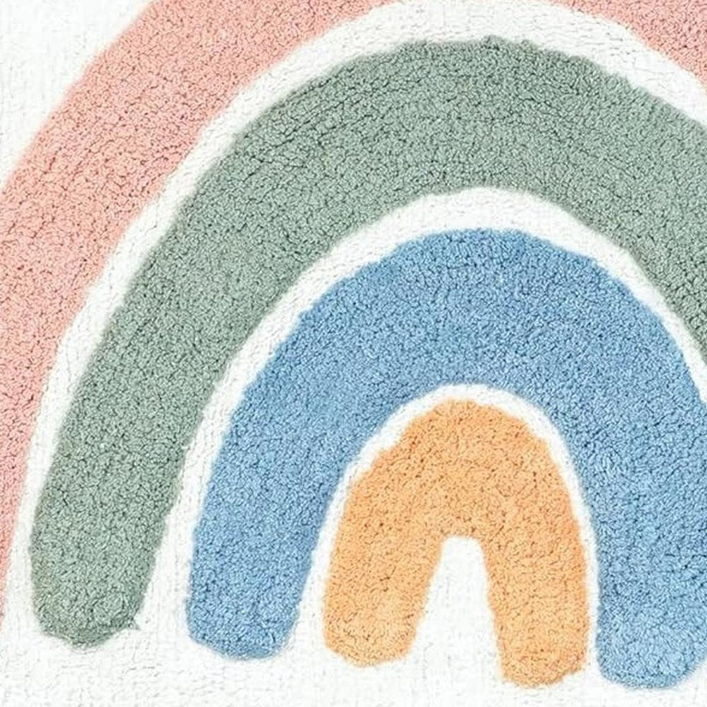 32" White Blue And Pink Cotton Rainbows Round Youthful Bath Rug. Bath rug isolated on a plain white background, in a blue cotton finish.