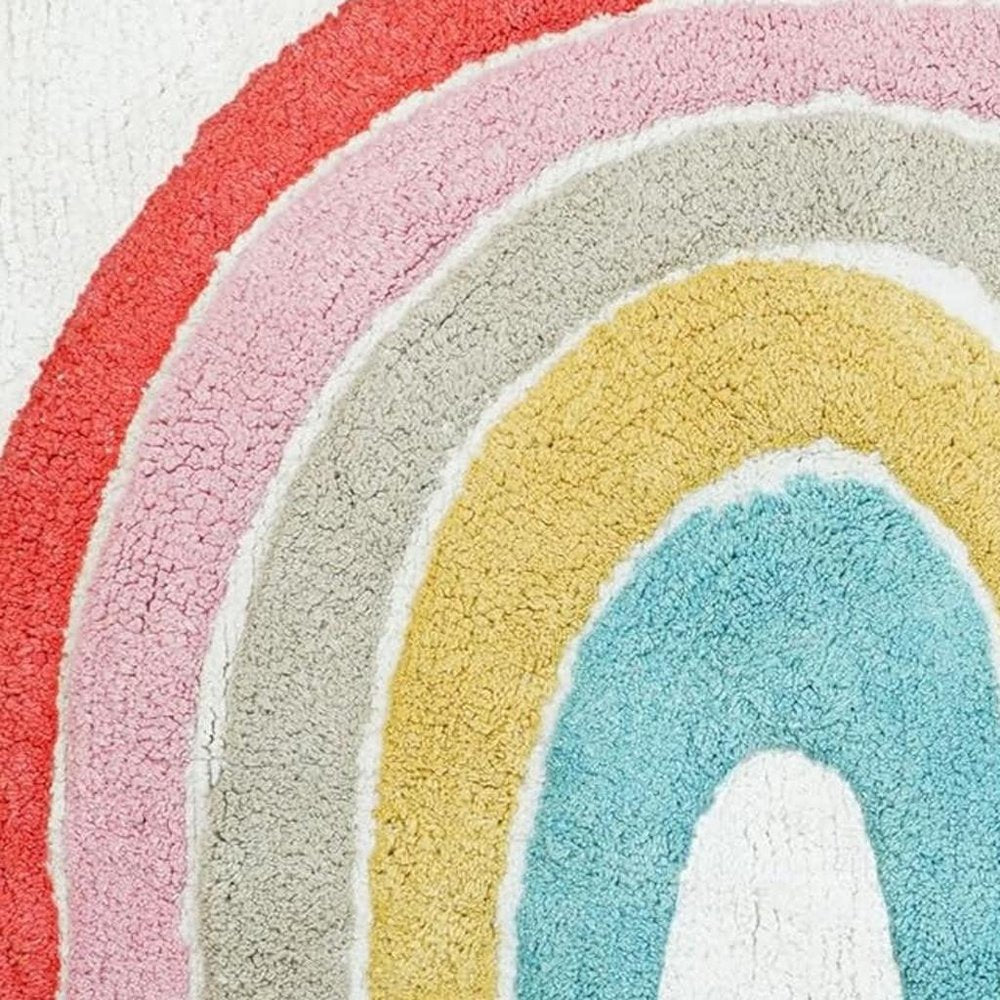 32" White Pink And Yellow Cotton Rainbows Round Youthful Bath Rug shown as a full-frame view of the blush and teal surface.