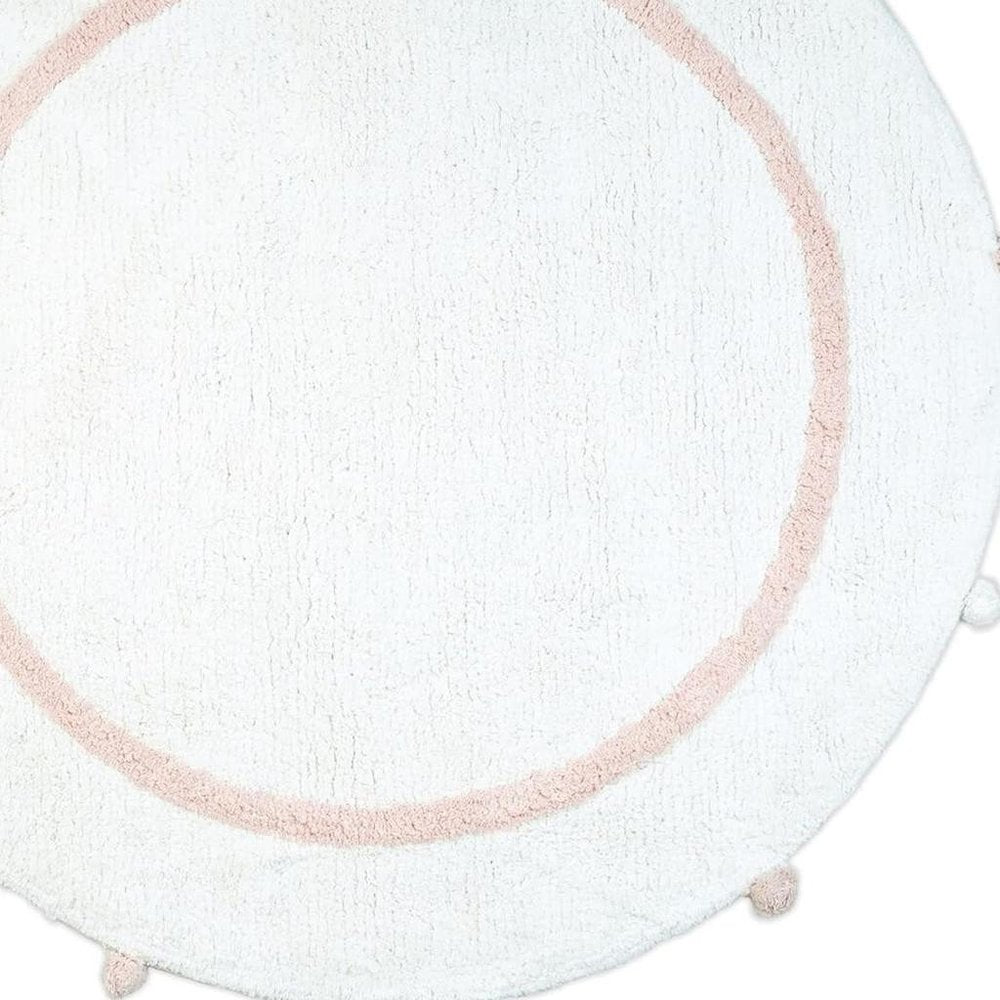 32" Light Pink And White Cotton Round Geometric Bath Rug. Bath rug isolated on a plain white background, finished in white cotton.