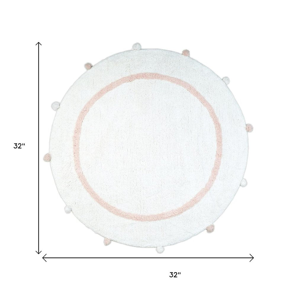 32" Light Pink And White Cotton Round Geometric Bath Rug. Bath rug isolated on a plain white background, in a white cotton finish.