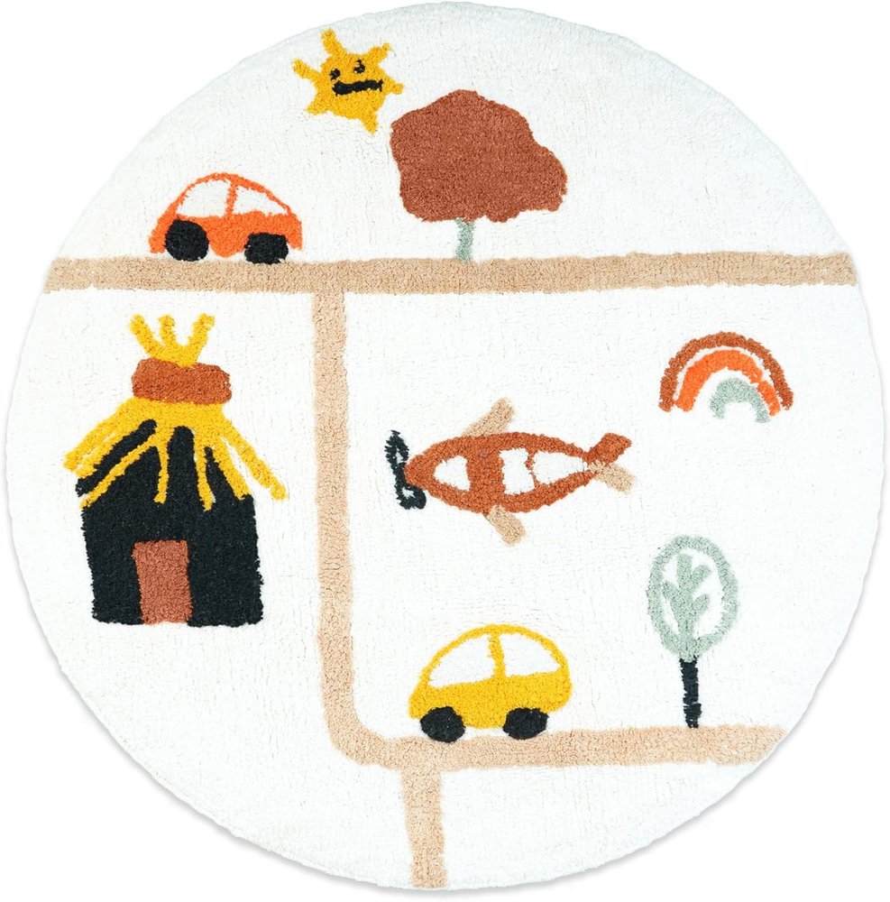 Round white cotton bath rug with a playful road scene featuring cars, a plane, a house, a tree, a rainbow, and a sun.