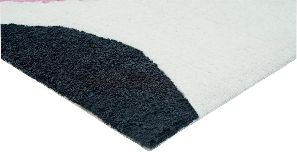 32" White Black And Pink Cotton Cow Youthful Bath Rug. Bath rug isolated on a plain white background, showing a black cotton surface.