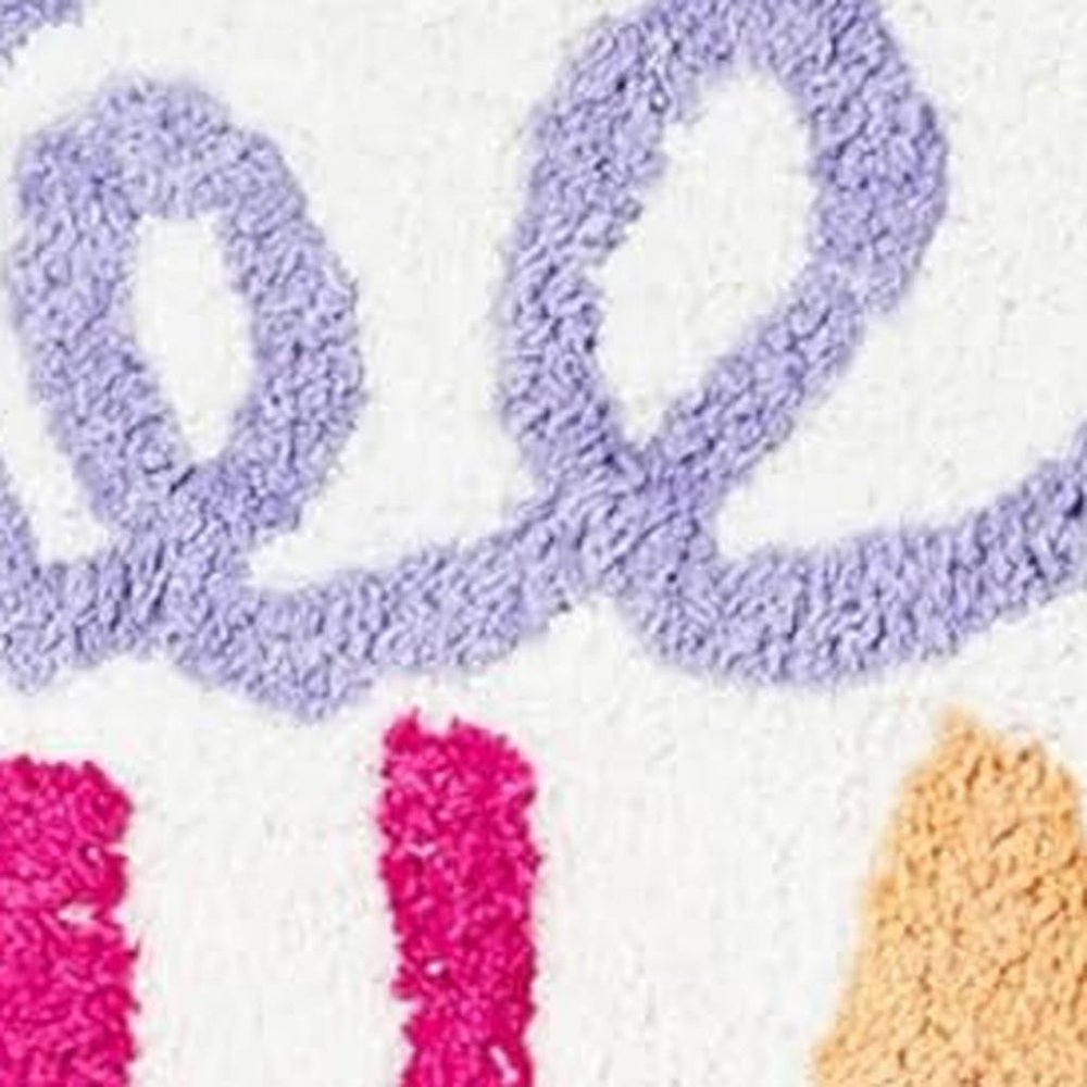32" White Purple And Green Cotton Be Happy Youthful Bath Rug. Bath rug in white cotton.