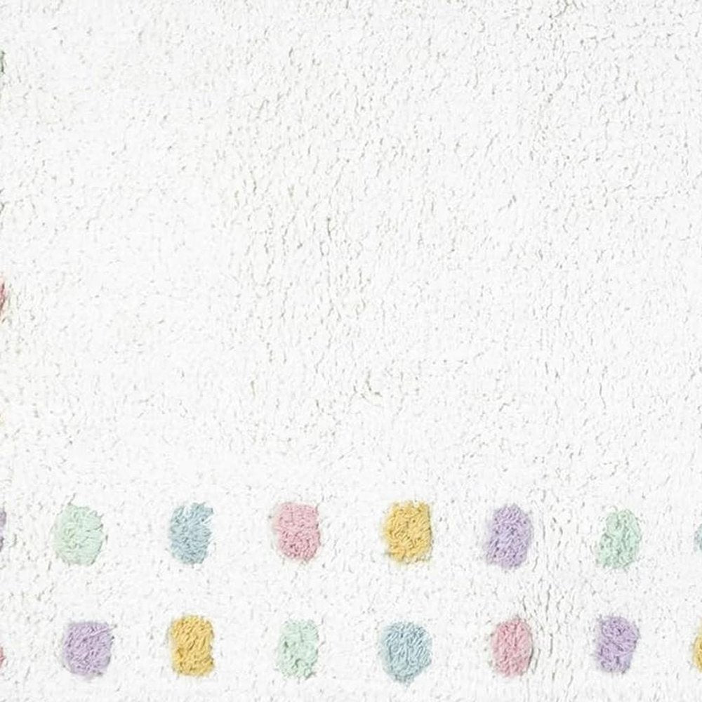 32" White Purple And Pink Cotton Polka Dots Bath Rug. Bath rug isolated on a plain white background, showing a white cotton surface.