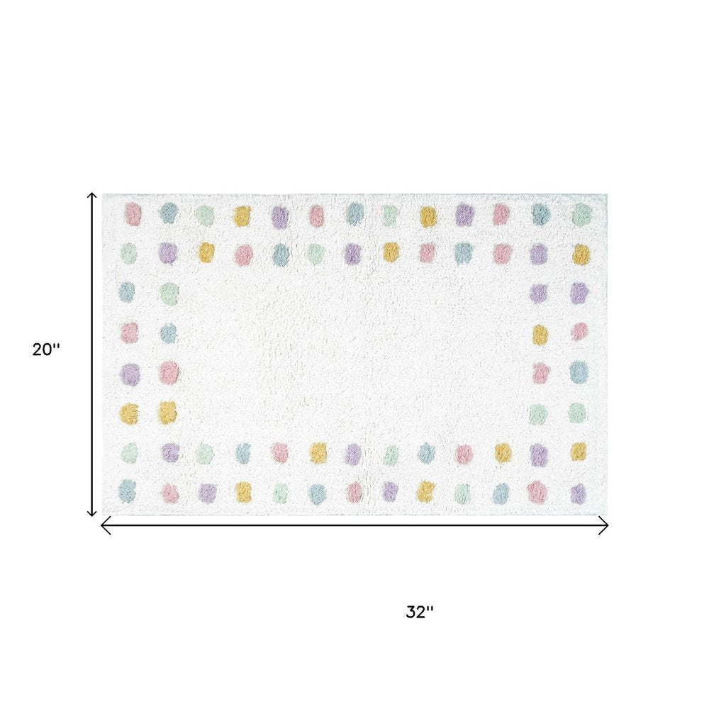 32" White Purple And Pink Cotton Polka Dots Bath Rug. Bath rug isolated on a plain white background, in a white cotton finish.