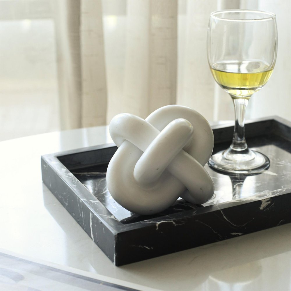 5" White Resin Knot Tabletop Sculpture. Sculpture isolated on a plain white background, finished in white resin.