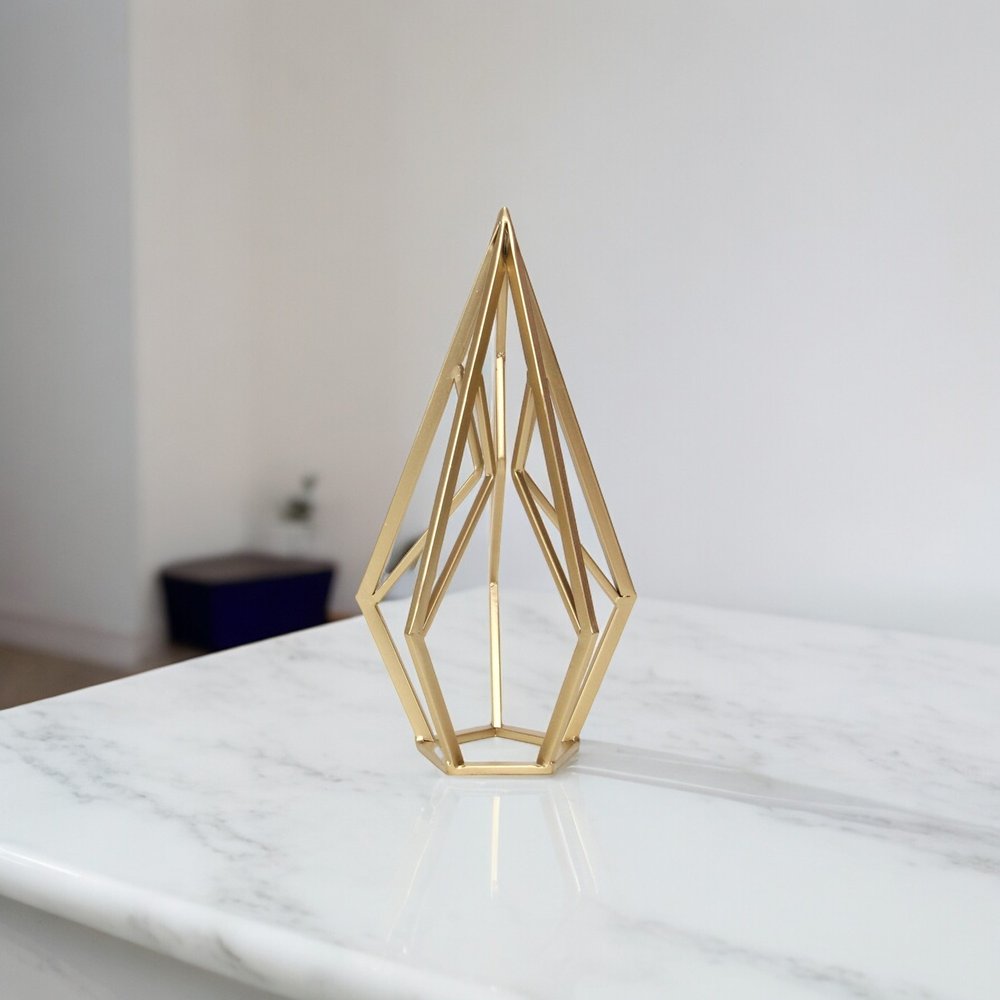 14" Gold Metal Open Geometric Tabletop Sculpture. Sculpture isolated on a plain white background, showing a metal surface.