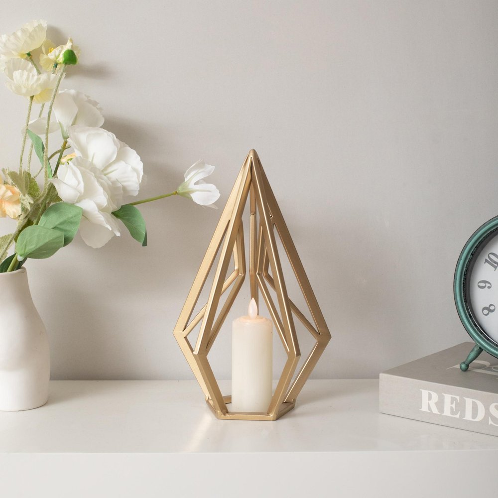 10" Gold Metal Open Geometric Tabletop Sculpture. Sculpture isolated on a plain white background, showing a gold metal surface.