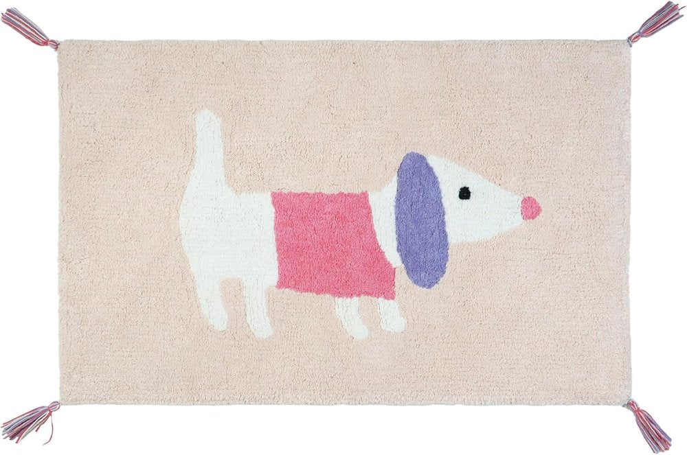 A pink and purple cotton bath rug with a white dog design and tassels on the corners.