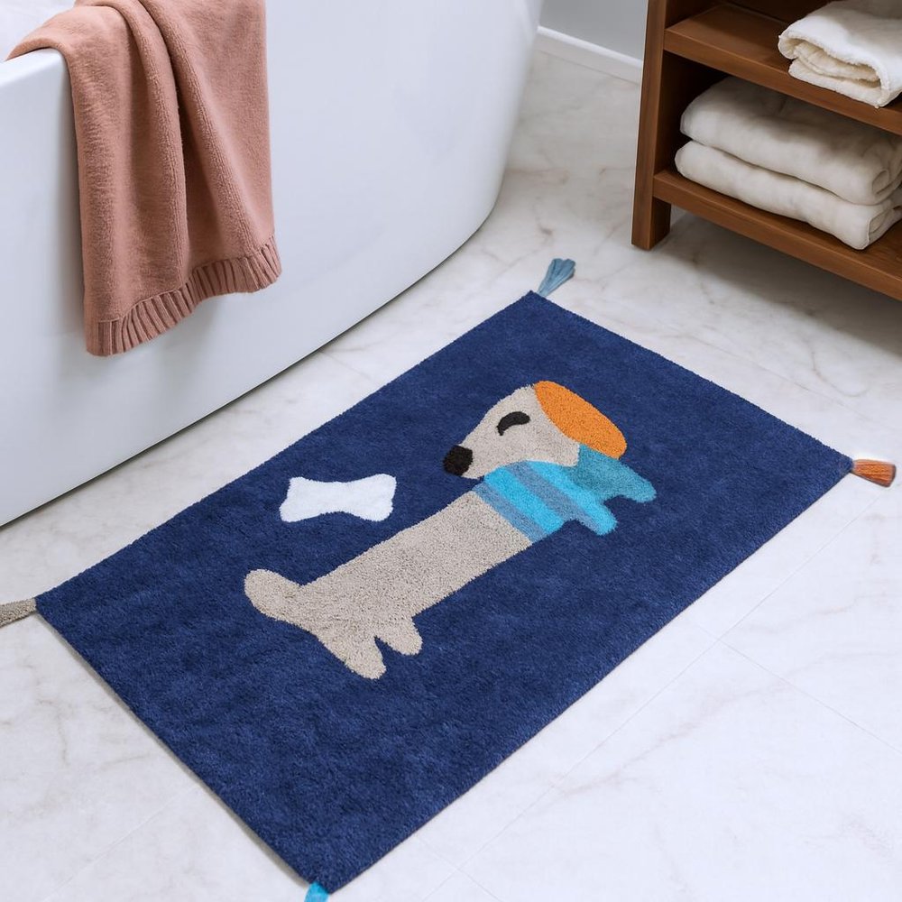 32" Blue Orange And White Cotton Dog Youthful Bath Rug shown outdoors on an outdoor setting.