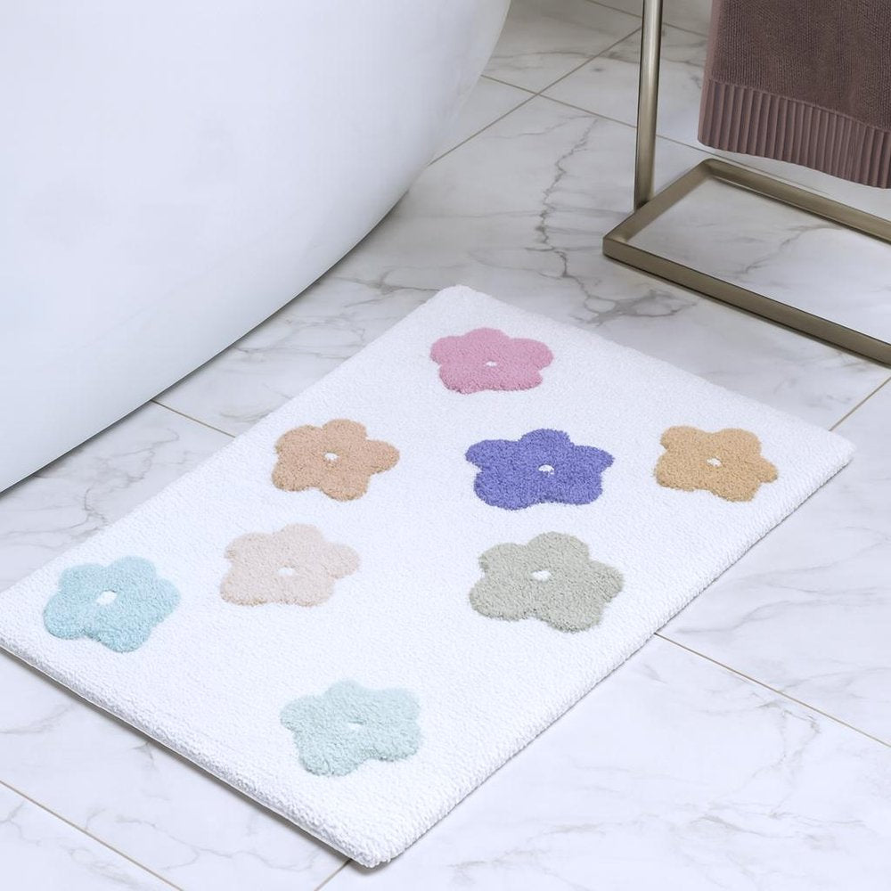 32" Pink And White Cotton Flowers Floral Floral Bath Rug shown outdoors on an outdoor setting.