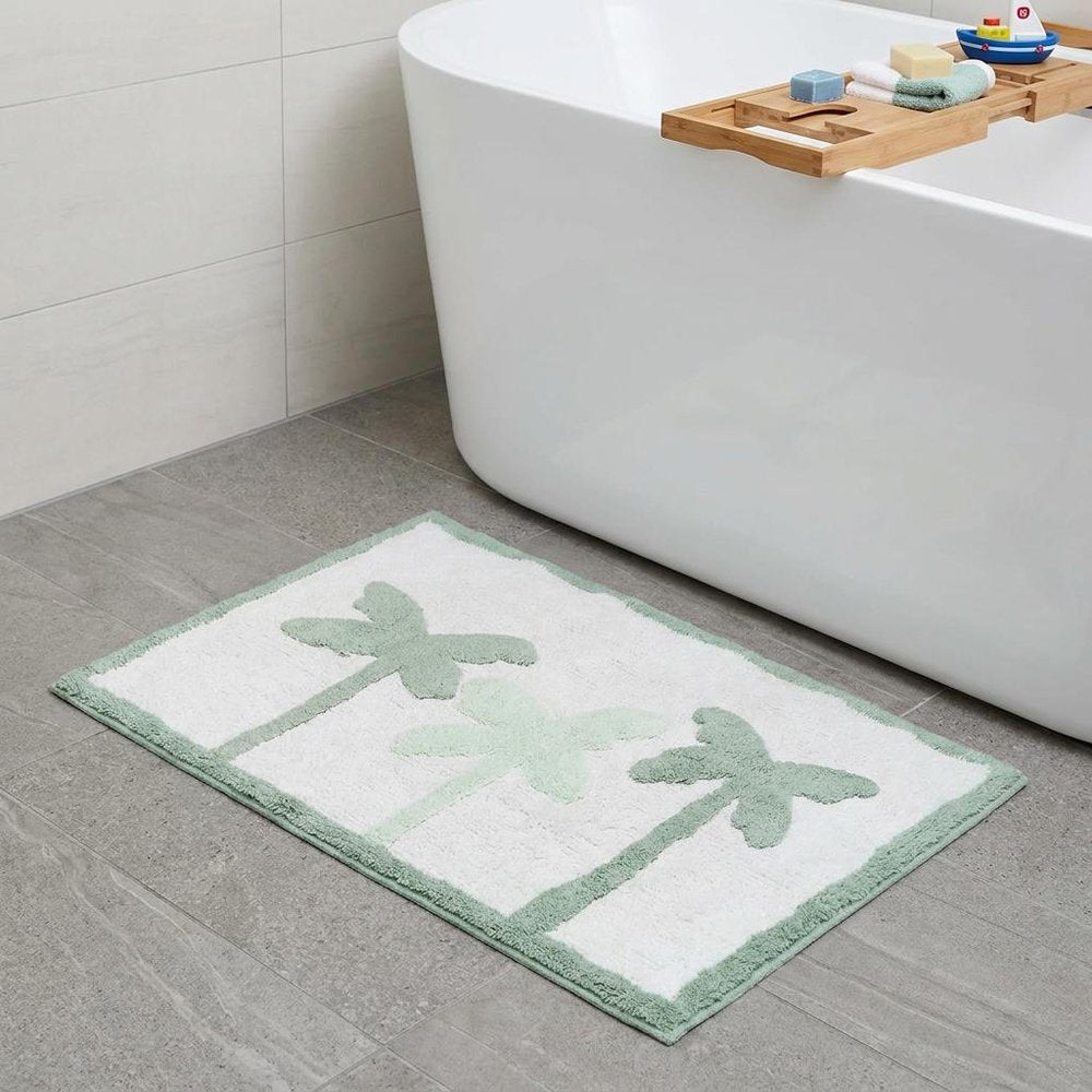 32" Green And White Cotton Palm Trees Bath Rug. Bath rug isolated on a plain white background, in a white cotton finish.