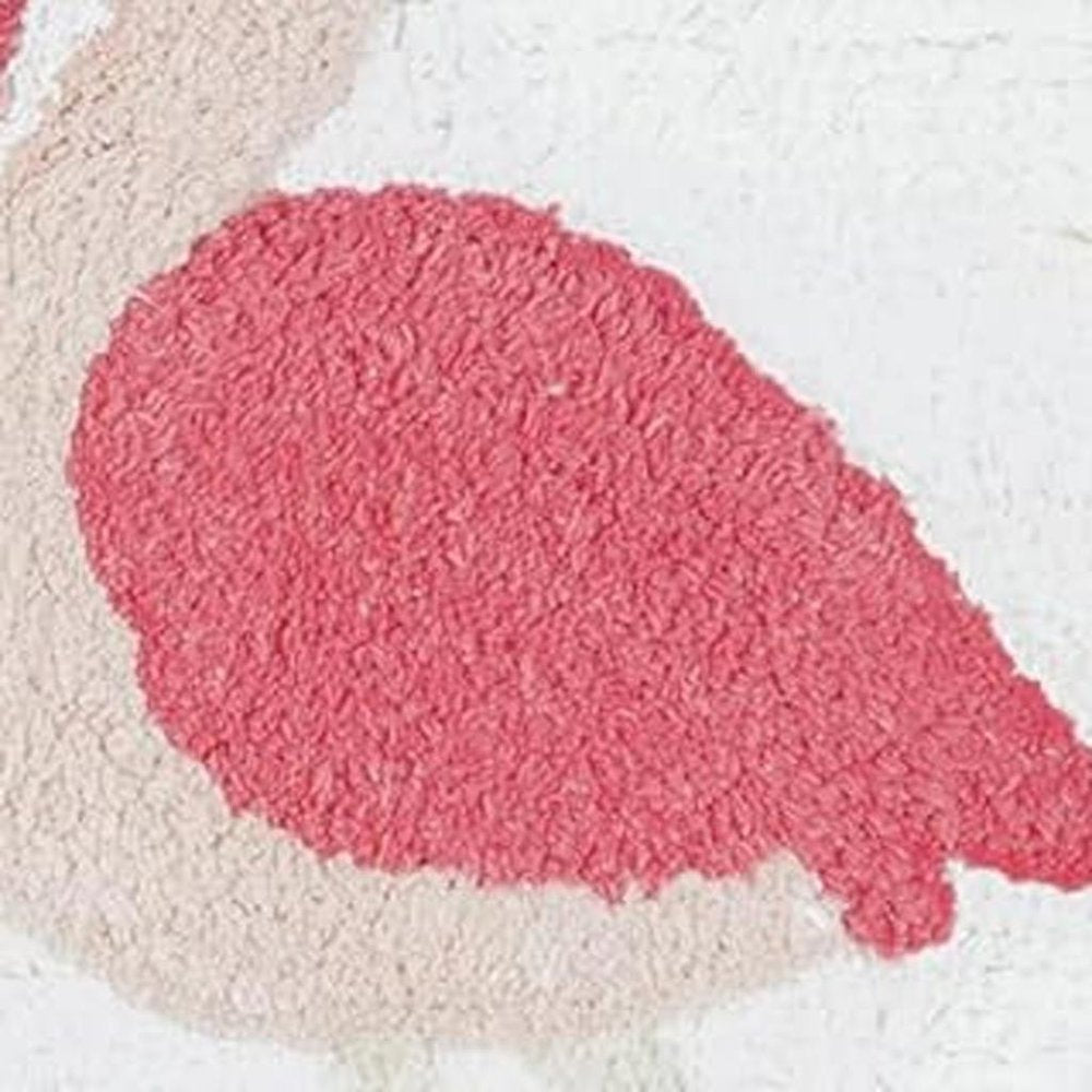 32" Pink And White Cotton Flamingo Bath Rug. Bath rug isolated on a plain white background, showing a white cotton surface.