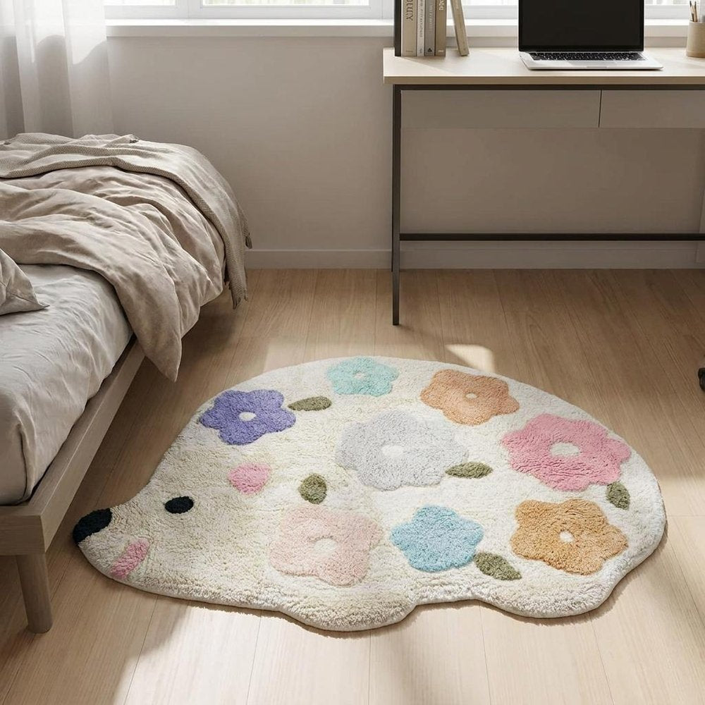 32" White Blue And Pink Cotton Hedgehog Floral Print Bath Rug laid on a tiled floor in a furnished interior.