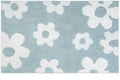 A blue cotton bath rug with a white floral pattern.