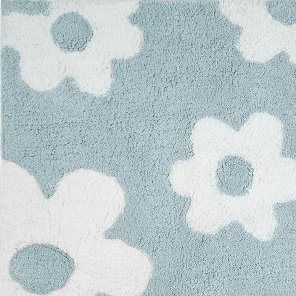32" Blue And White Cotton Floral Bath Rug close-up highlighting the white cotton surface.
