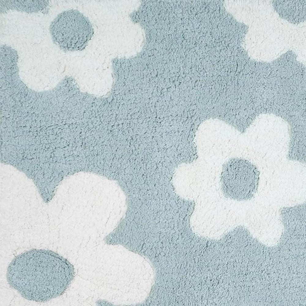 Close-up of 32" Blue And White Cotton Floral Bath Rug showing the white cotton texture.