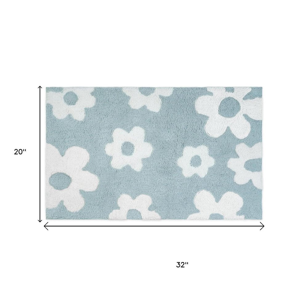 32" Blue And White Cotton Floral Bath Rug. Bath rug isolated on a plain white background, in a white cotton finish.