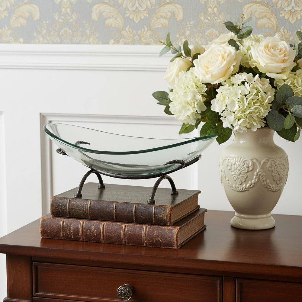 17" Clear And Black Glass And Metal Oval Decorative Bowl With Stand. Home product in black glass.