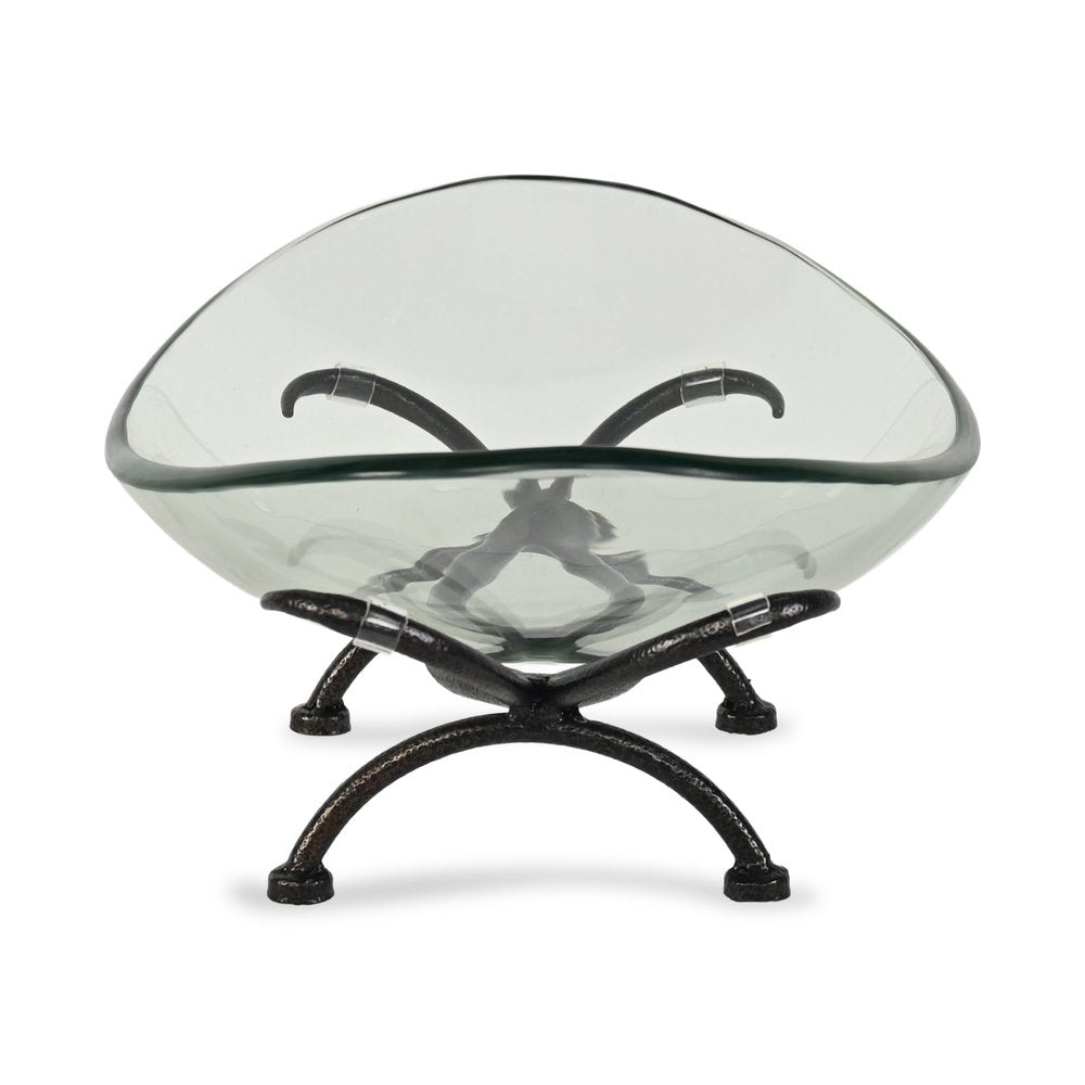 17" Clear And Black Glass And Metal Oval Decorative Bowl With Stand. Home product isolated on a plain white background, showing a clear glass surface.