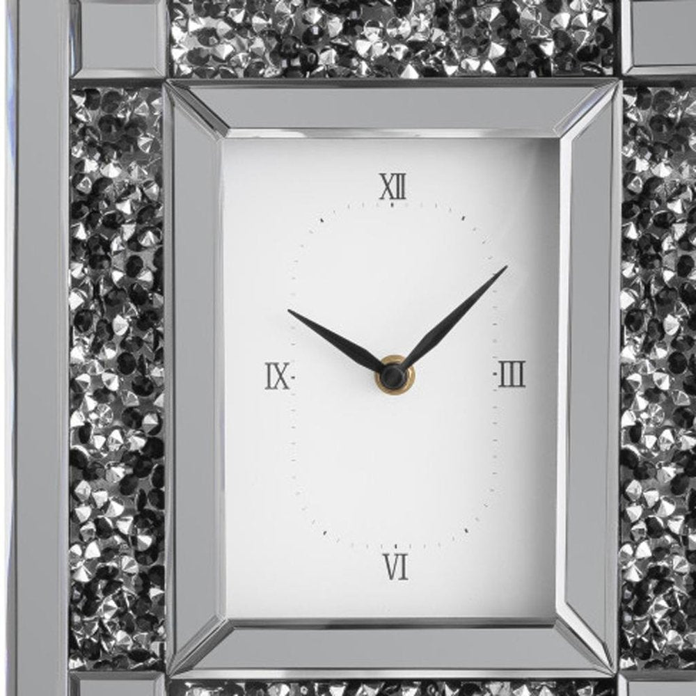 16" Silver And Black Faux Crystal And Mirrored Glass Table Clock. Wall clock isolated on a plain white background, showing a silver glass surface.