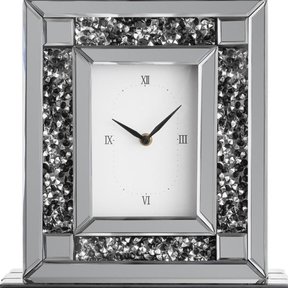 16" Silver And Black Faux Crystal And Mirrored Glass Table Clock. Wall clock isolated on a plain white background, finished in silver glass.