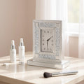 Cropped view of 16" Silver And White Faux Crystal And Mirrored Glass Table Clock focusing on the white glass surface.