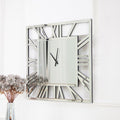 27" Silver Mirrored Glass Silent Analog Square Wall Clock. Wall clock isolated on a plain white background, finished in silver glass.