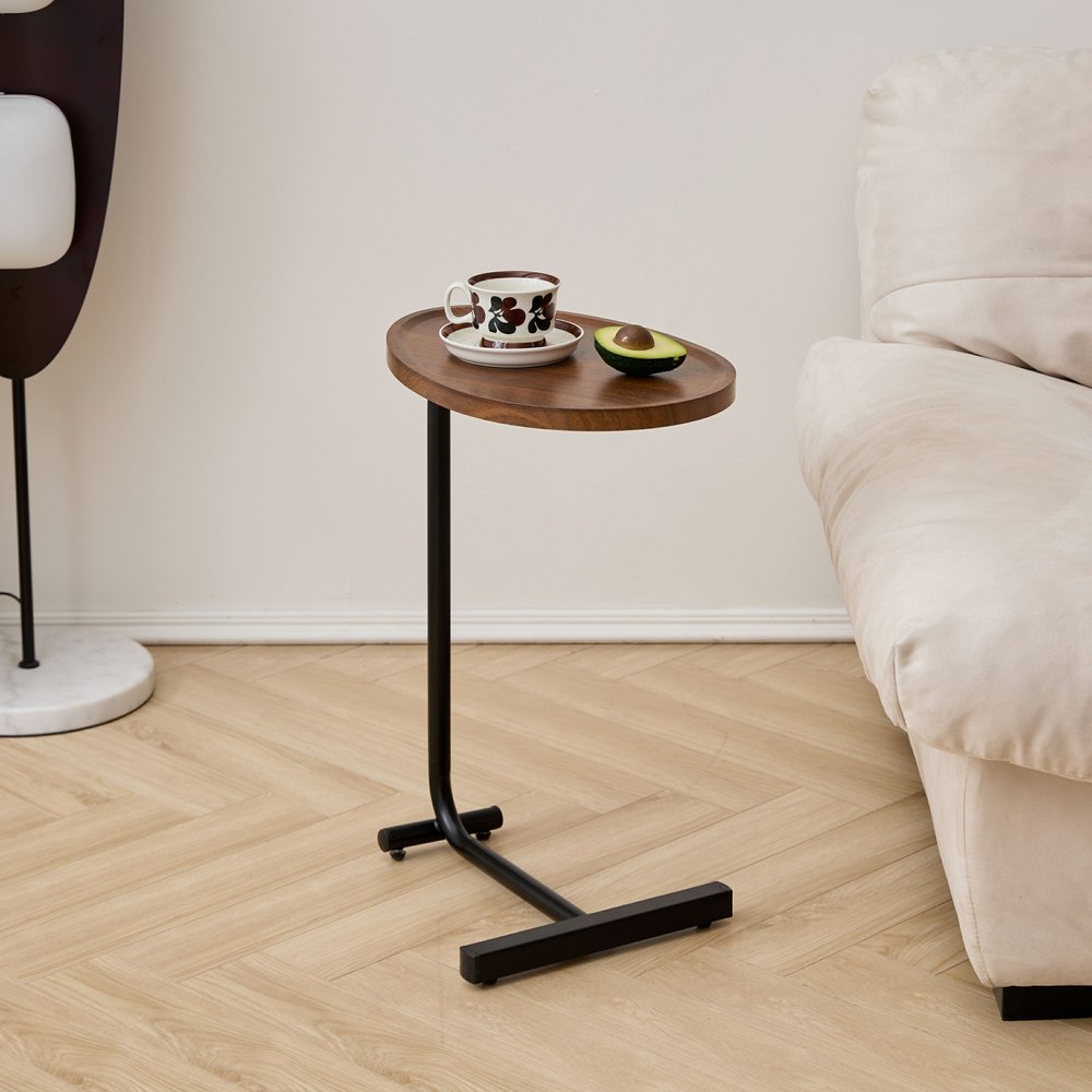 Set of Two Brown and Black Wood and Metal Oval End Tables in a home interior