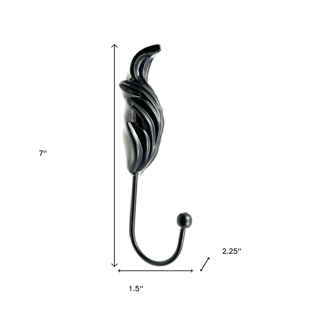 Set of Six Black Steel Feather Wall Hooks on a white background