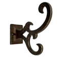 Set of Six Antiqued Bronze Cast Iron Scroll Wall Hooks on a white background