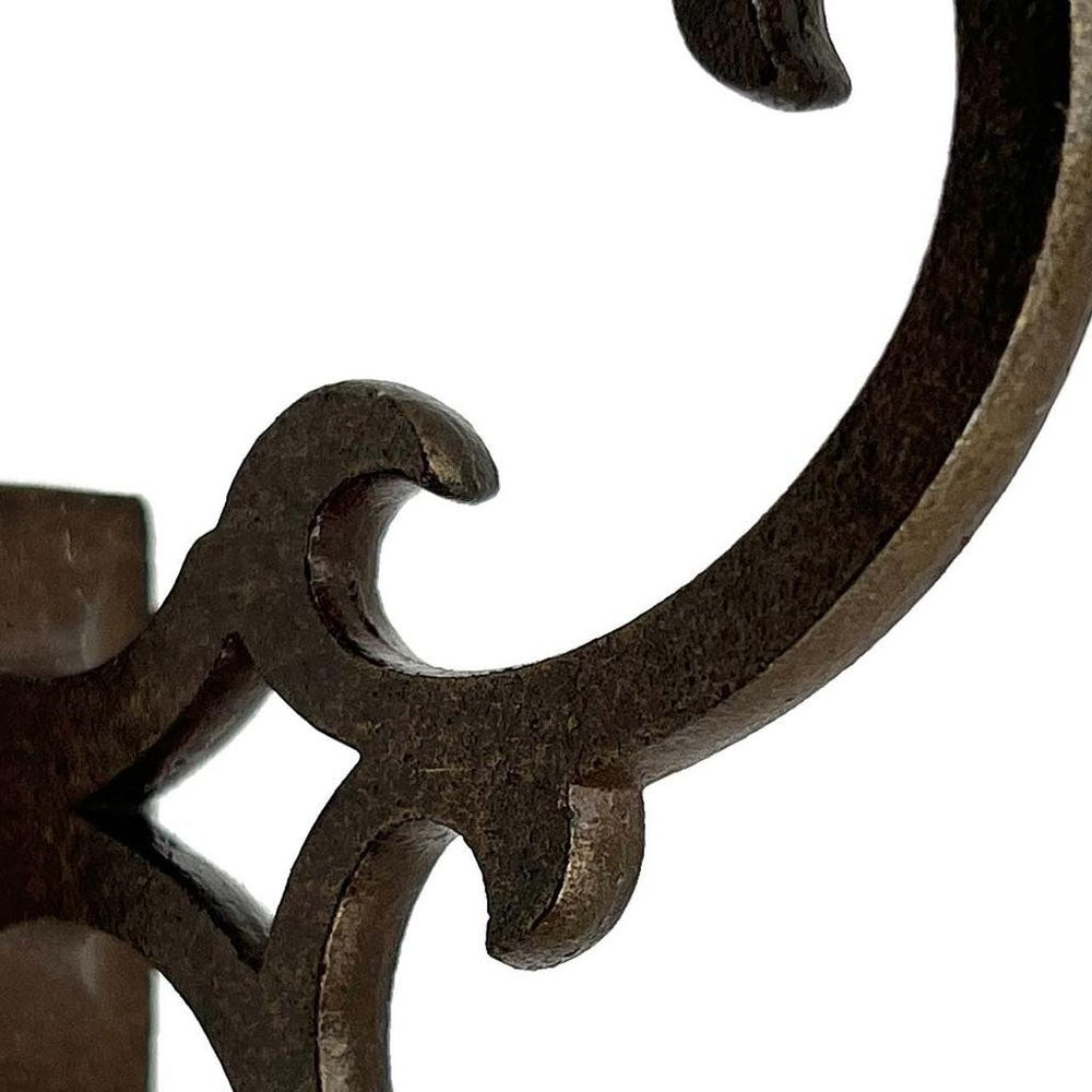 Set of Six Antiqued Bronze Cast Iron Scroll Wall Hooks on a white background