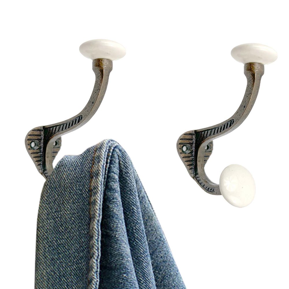 Set of Six Bronze And White Cast Iron And Ceramic Double Wall Hooks on a white background
