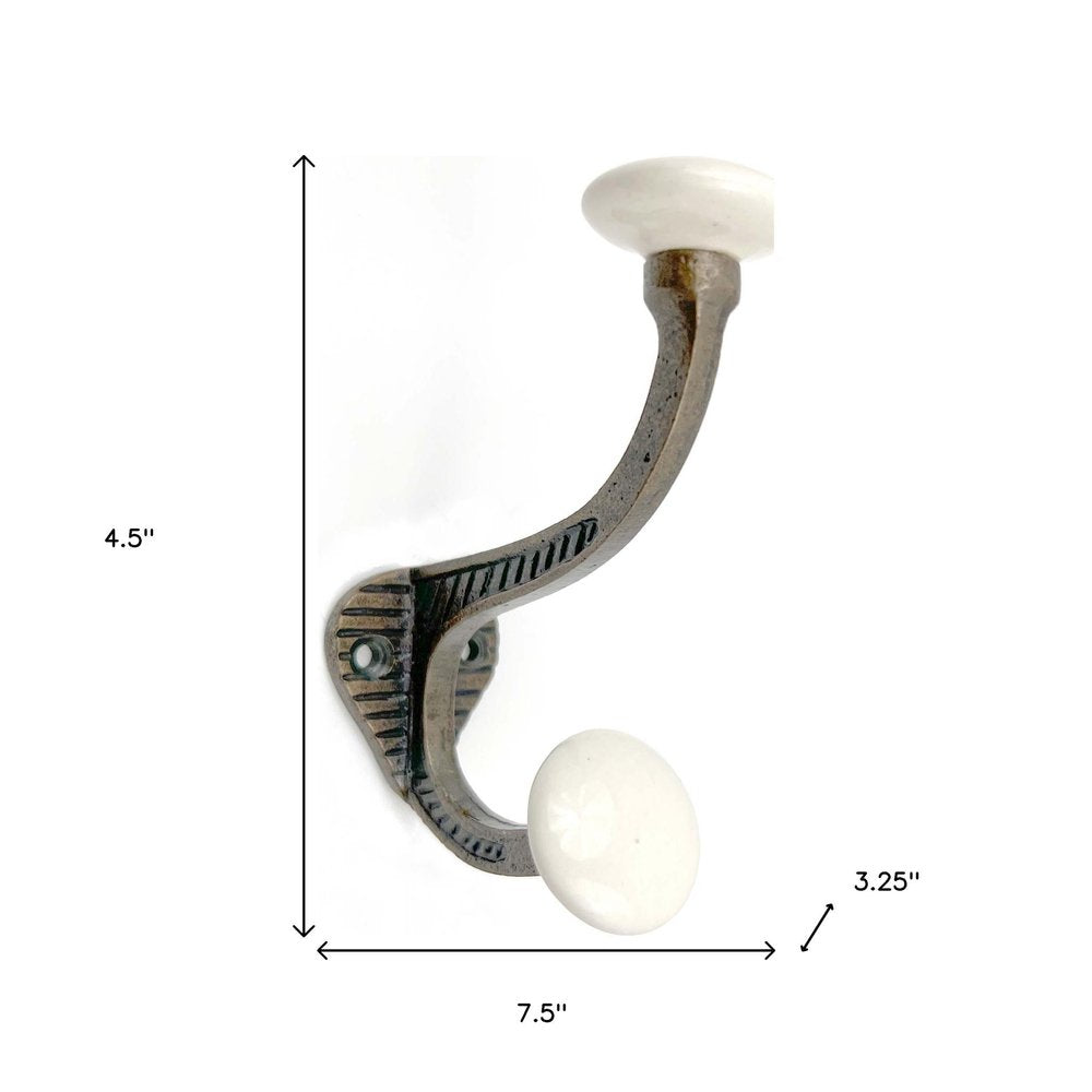 Set of Six Bronze And White Cast Iron And Ceramic Double Wall Hooks on a white background