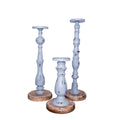 Set of Three Gray Distressed Wood Tabletop Pillar Candle Holders on a white background
