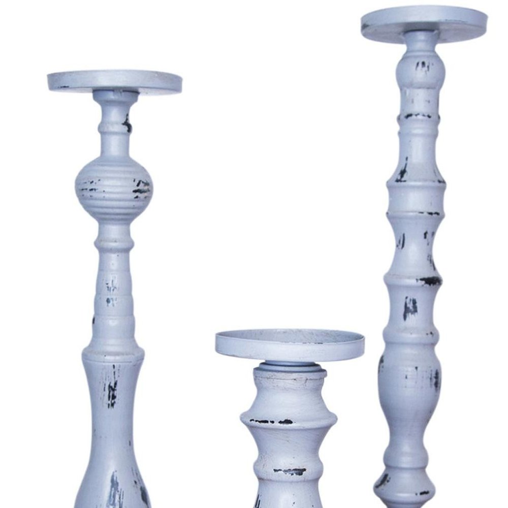 Set of Three Gray Distressed Wood Tabletop Pillar Candle Holders on a white background