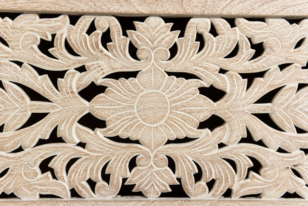 52" White Solid Wood Floral Ottoman With Storage close-up highlighting the white wood surface.