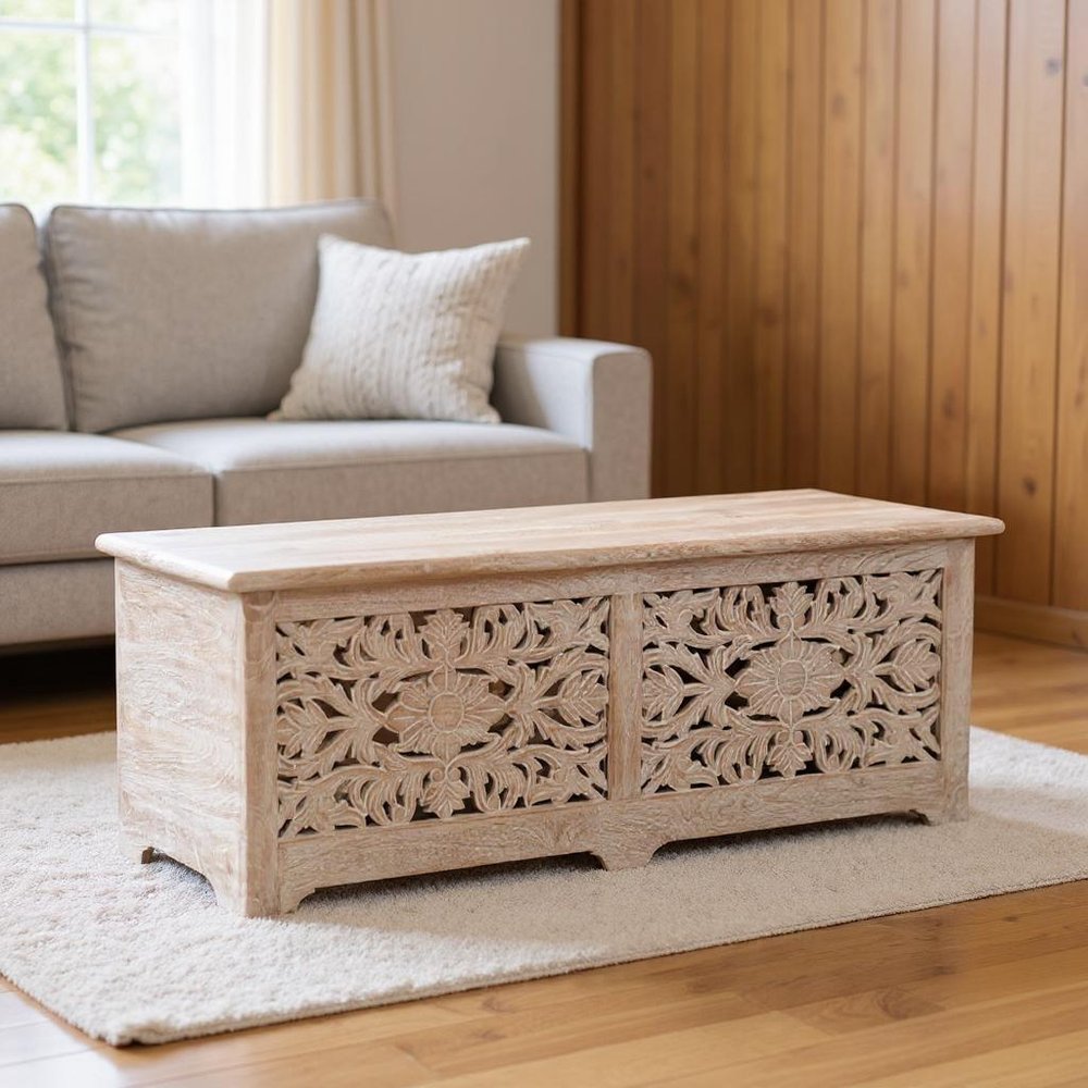 52" White Solid Wood Floral Ottoman With Storage styled in a furnished interior with a tan wall on a wood floor.
