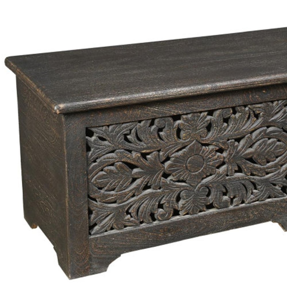 52" Black Solid Wood Floral Ottoman With Storage. Ottoman isolated on a plain white background, finished in black wood.