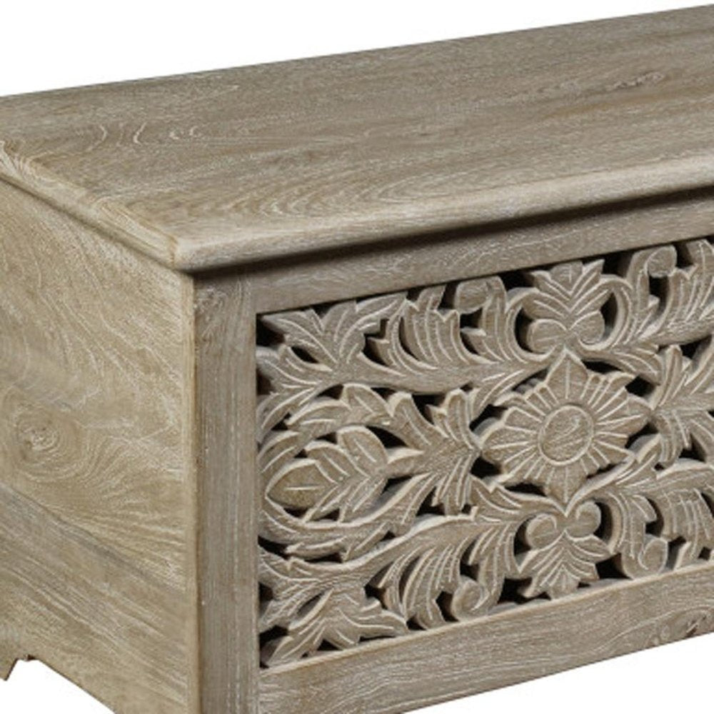 Detail view of 52" Gray Solid Wood Floral Ottoman With Storage, filling the frame with the wood texture.