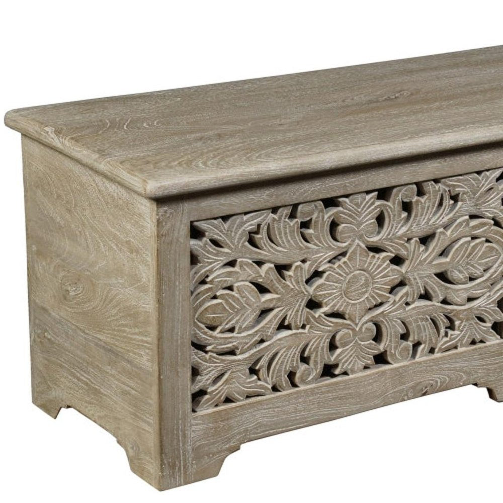 52" Gray Solid Wood Floral Ottoman With Storage. Ottoman isolated on a plain white background, showing a wood surface.