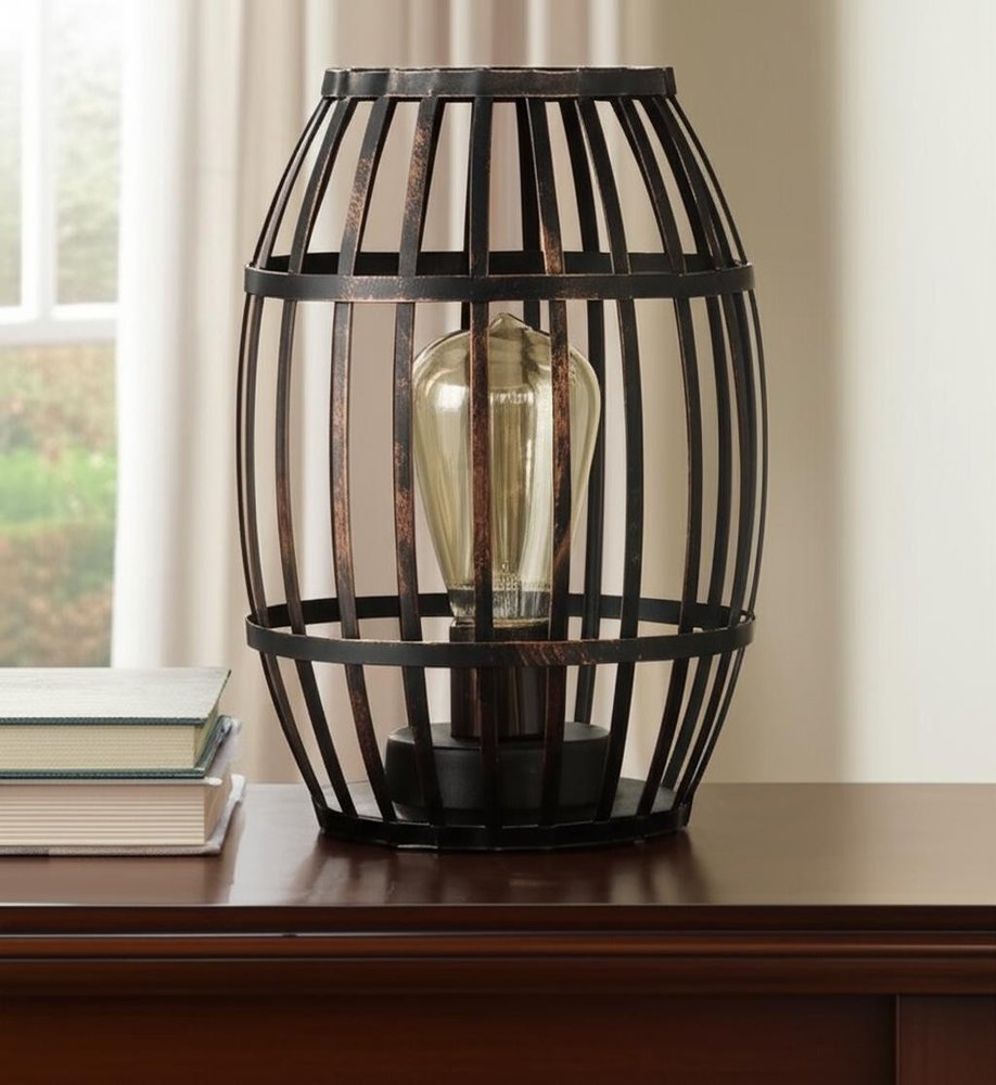 8" Black Battery Operated Novelty Bedside Lamp With Cage Shade in a home interior