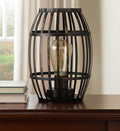 8" Black Battery Operated Novelty Bedside Lamp With Cage Shade in a home interior