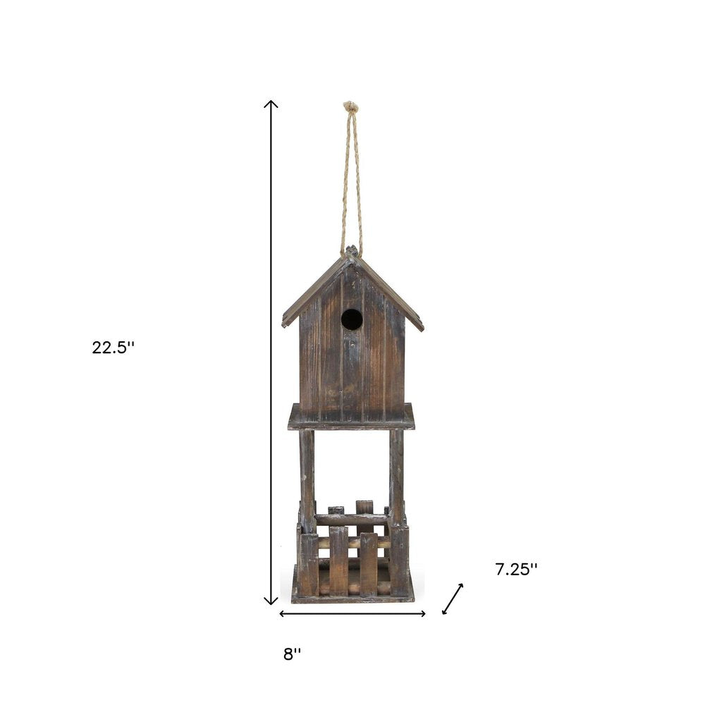 23" Brown Wood House Hand Painted Decorative Bird House. Outdoor bird accessorie isolated on a plain white background, in a brown wood finish.