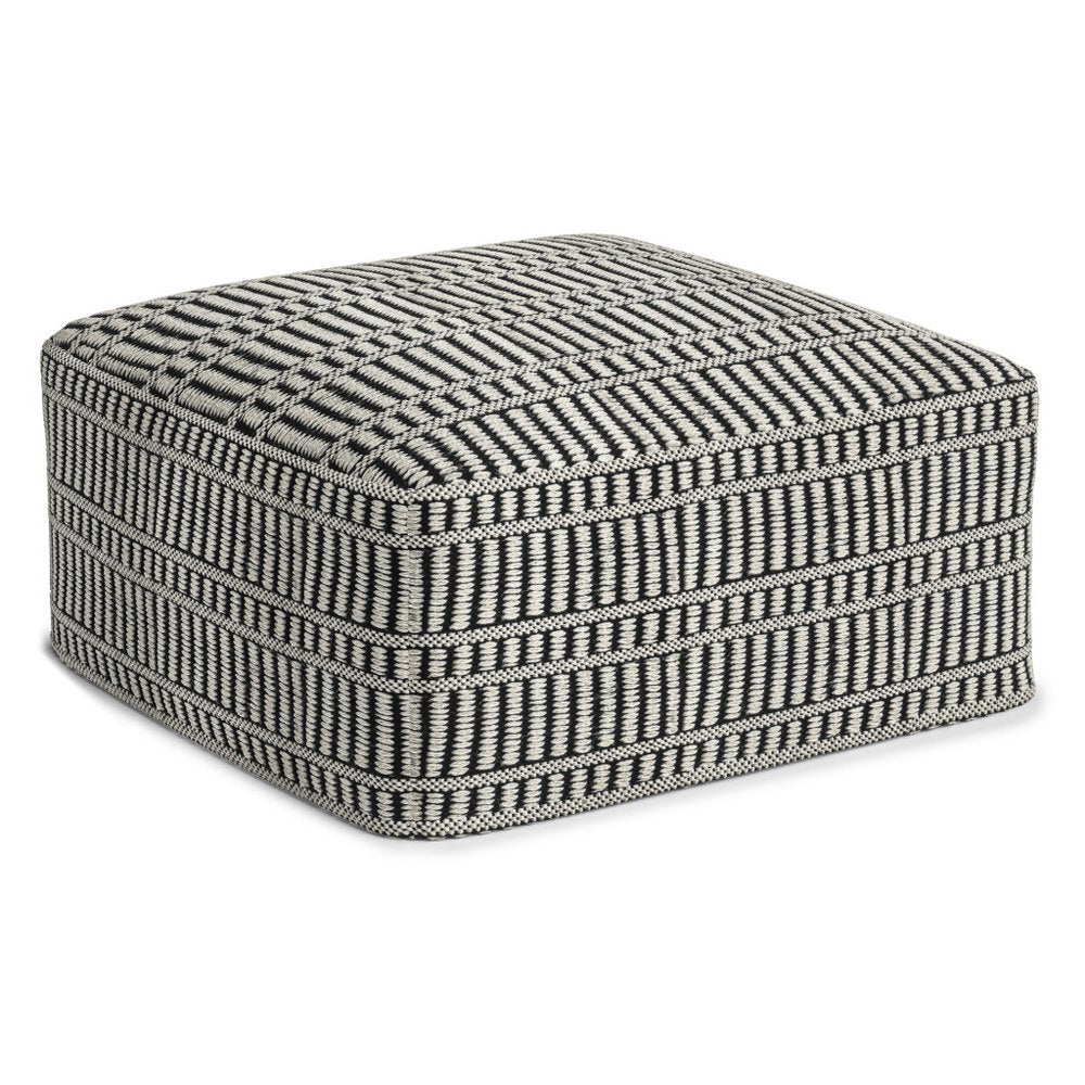 Black and white geometric patterned polyester ottoman on a white background.