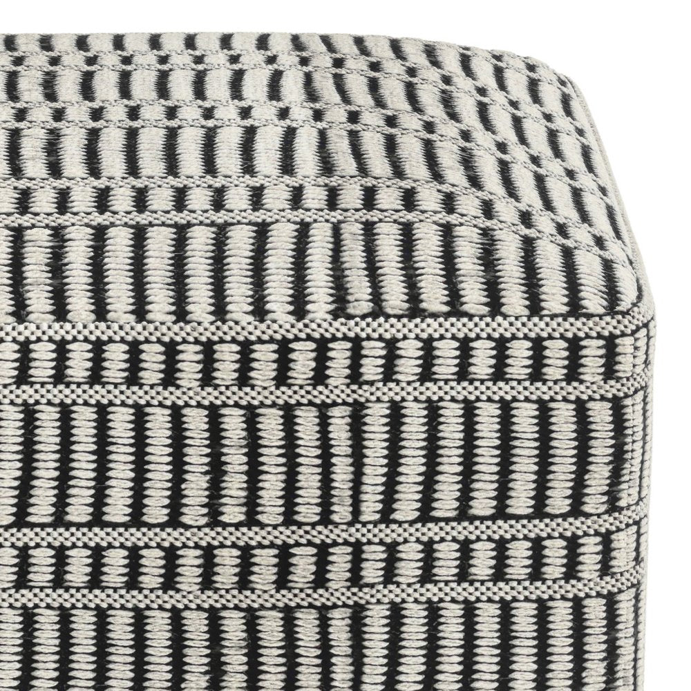 Close-up of 20" Black And White Polyester Geometric Outdoor Pouf Ottoman showing black fabric detail.