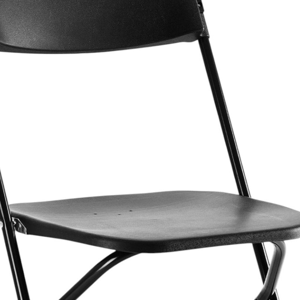 Set of Four Black Metal Outdoor Folding Stacking Dining Chairs on a white background