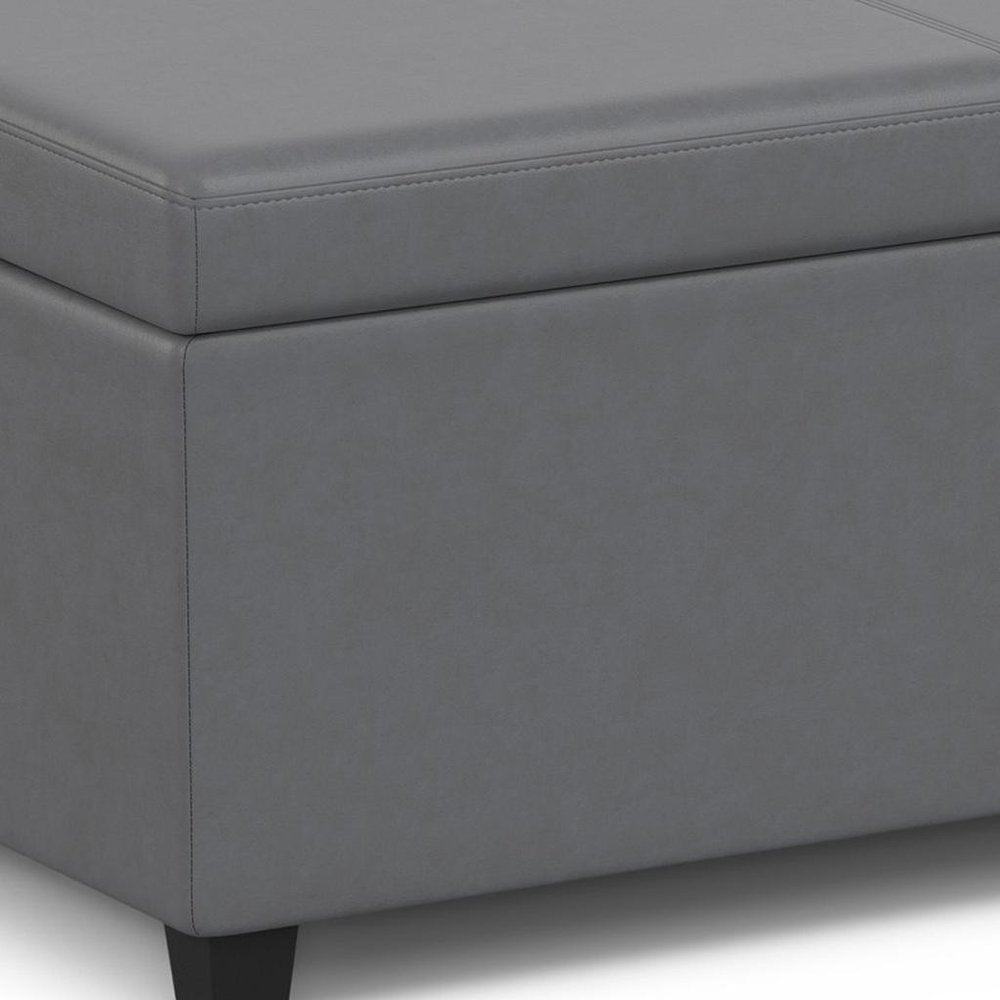Close-up of 54" Slate Gray and Dark Brown Linen Blend and Solid Wood Upholstered Storage Bench With Flip Top showing the gray wood texture.
